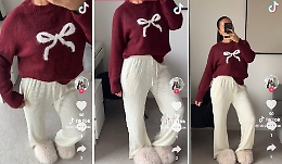 Il maglione di Natale H&M che sta conquistando TikTok: perch&eacute; il pullover corto bianco con fiocco rosso &egrave; il protagonista dell&rsquo;inverno 2025